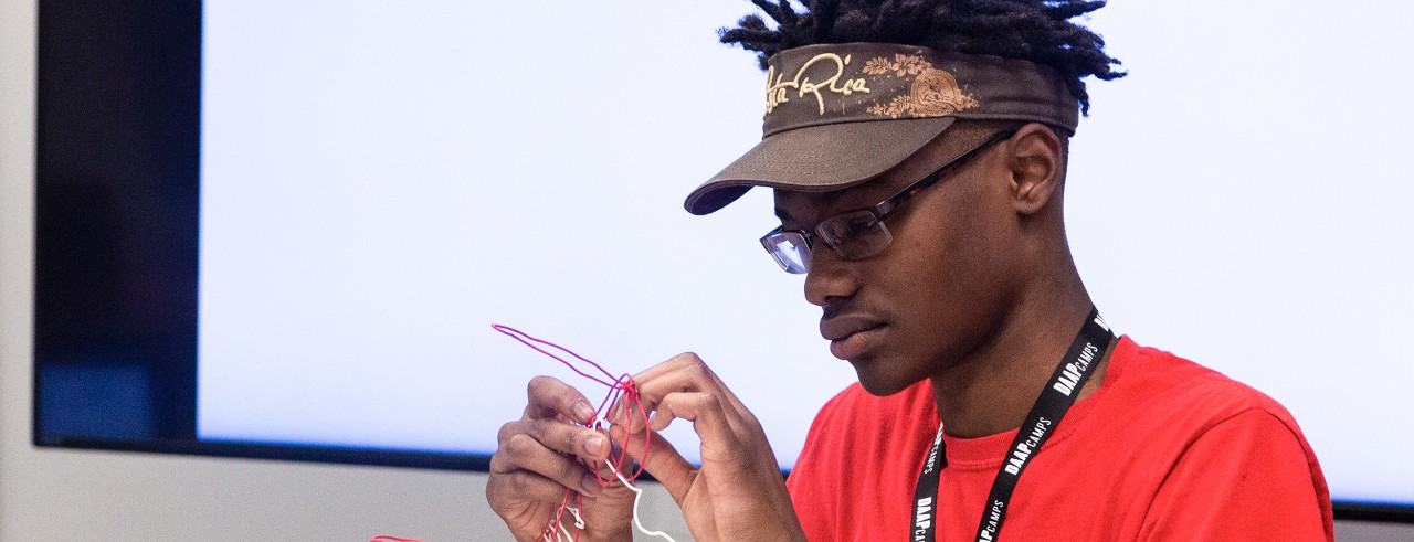 male student at camp