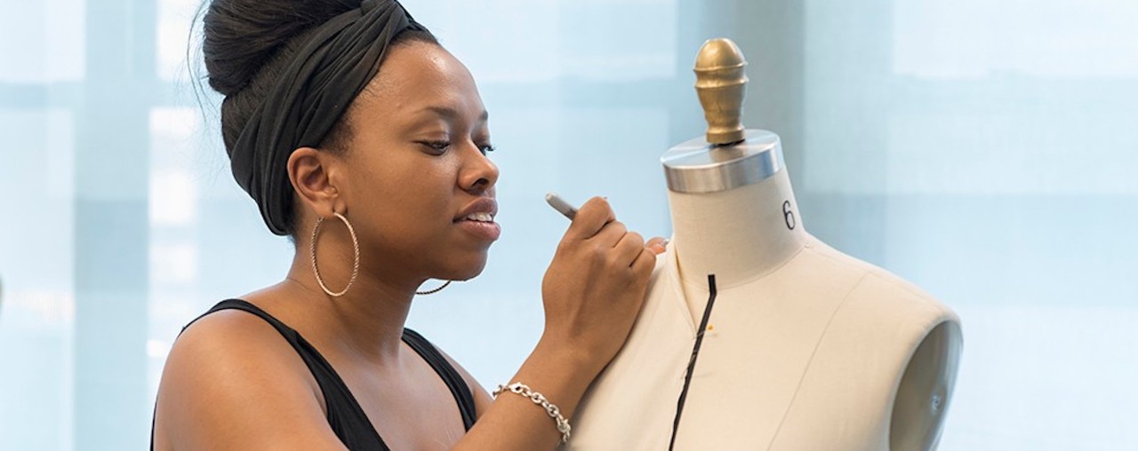 Fashion designer works on a dress form