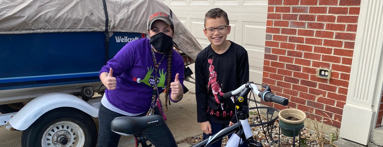 coach with young student and bike