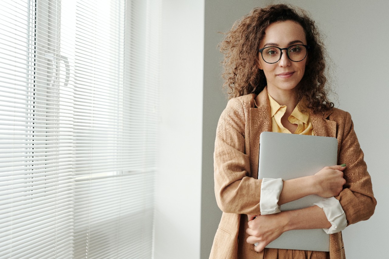woman holding laptop