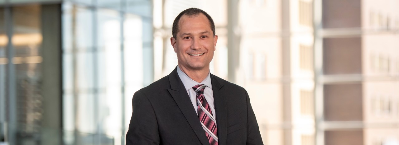 Dr. Brett Kissela standing on bridge