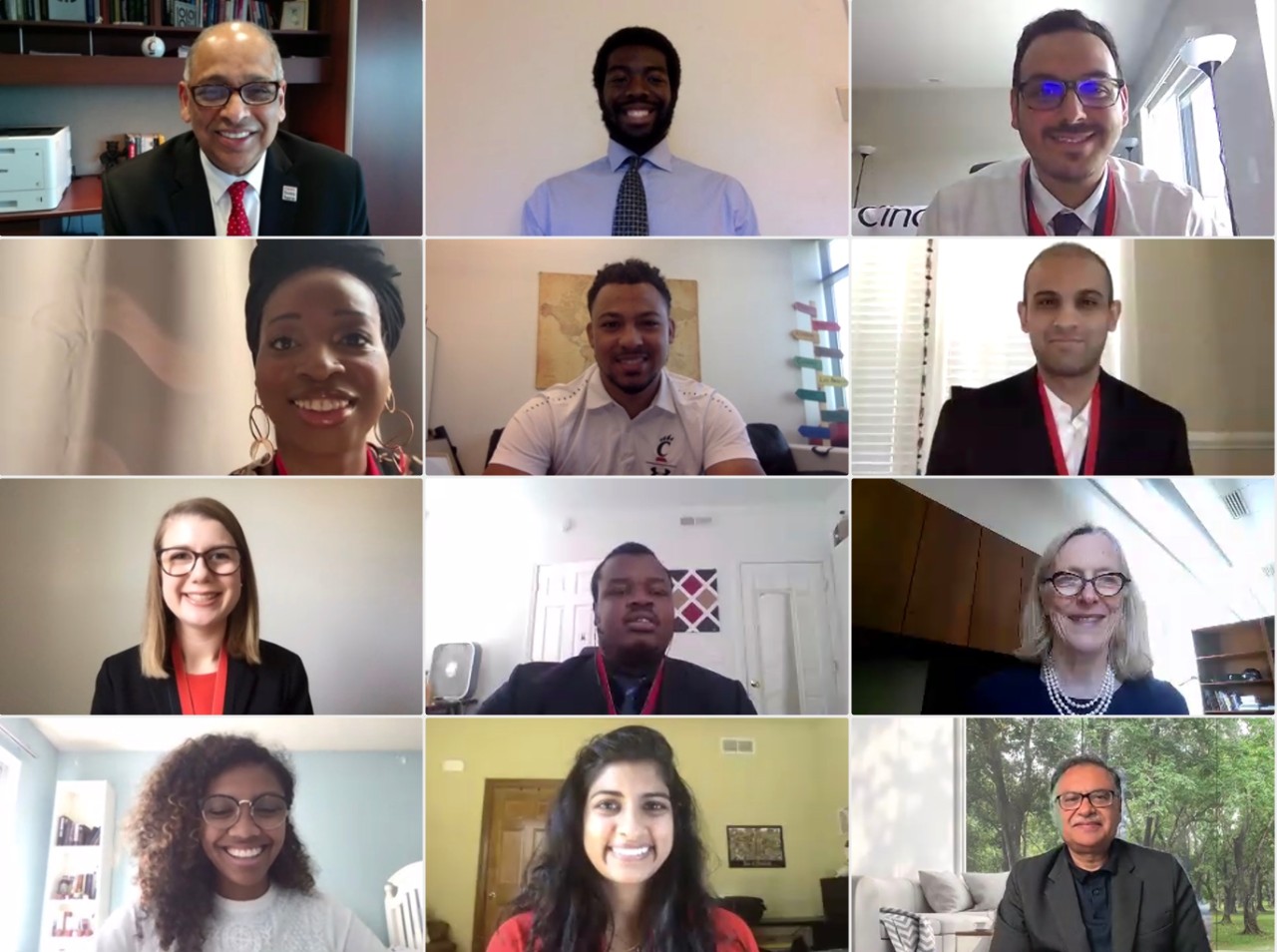 Virtual screen with 12 windows showing UC students and leadership during a PLME and PMGSE ceremony in 2021.