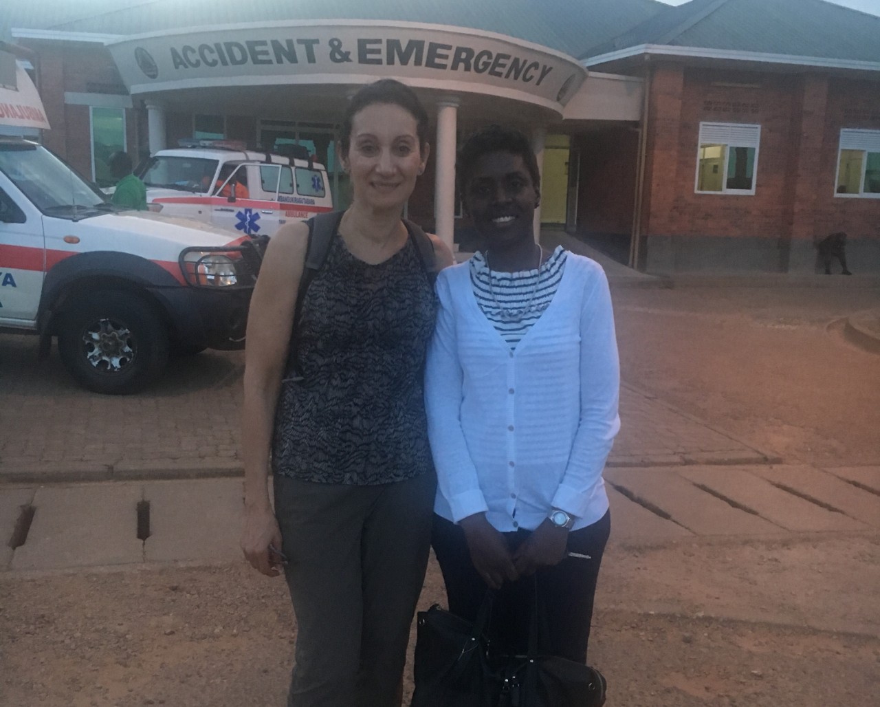 Dr. Hanan Kerr with cardiologist outside Rwandan hospital 