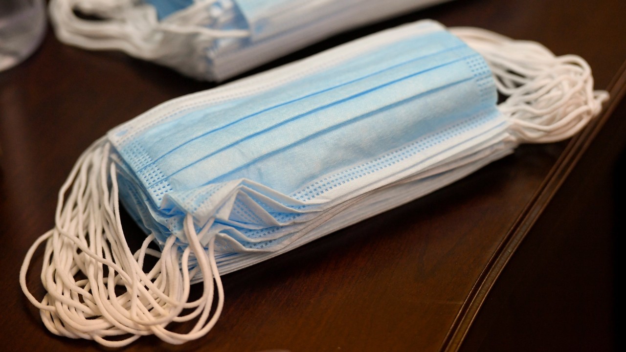 A pile of face masks on a table 