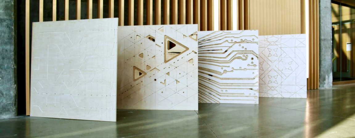 Four large wood panels lined up along a hallway.