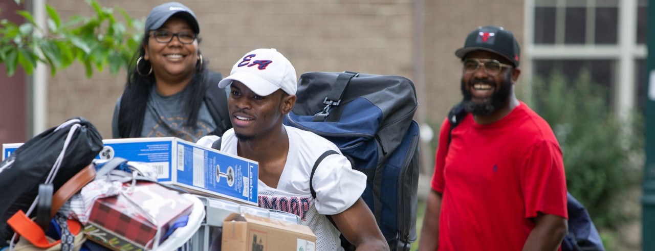 A family moving their student into a UC dorm