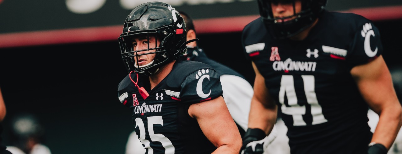 Ryan Royer in football uniform on the field