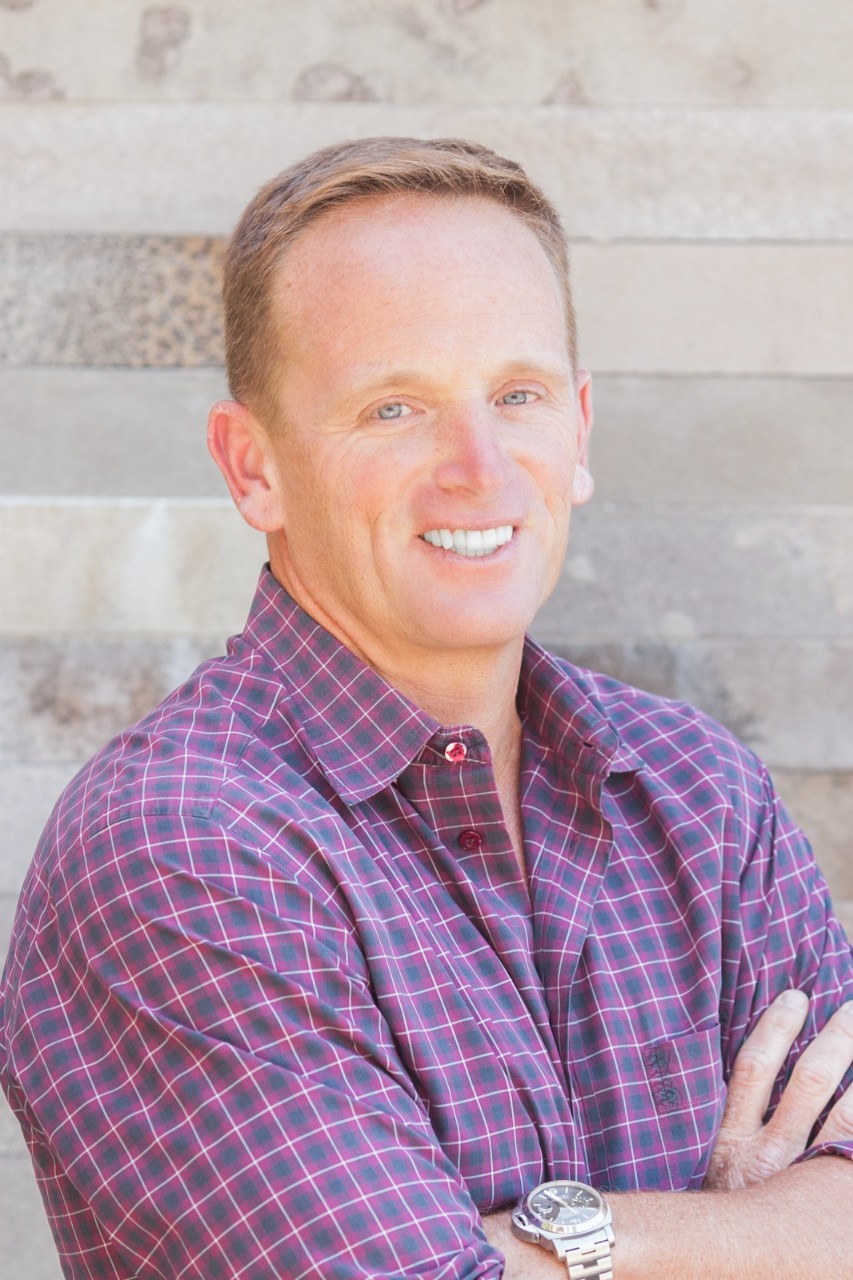 Jim Goetz (man) wearing checked shirt.