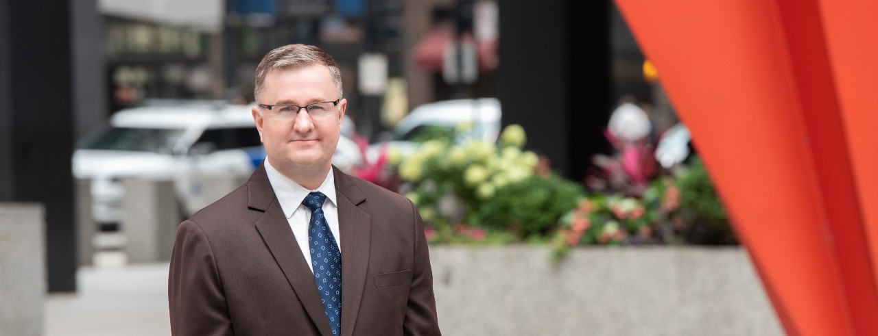 DSS agent Benjamin Sides standing in a plaza 