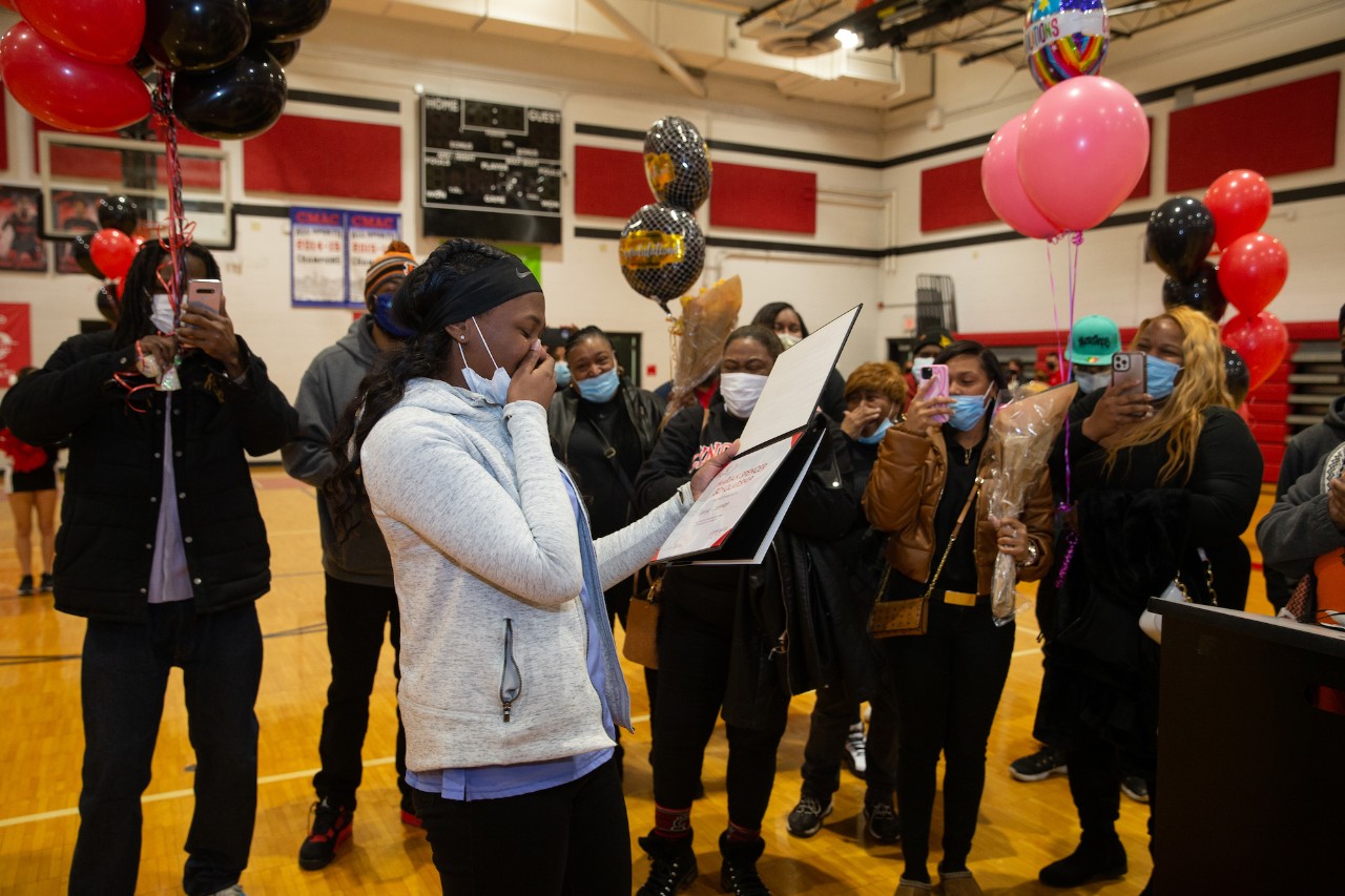Student surprised with certificate in gym