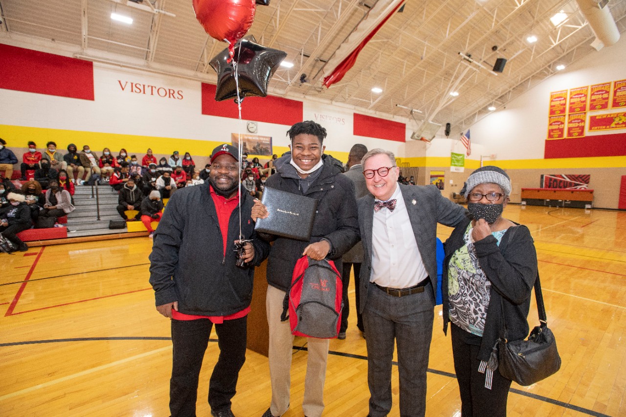 Jack Miner, Vice Provost for Enrollment Management surprised Jalen Tucker future UC Bearcats with Marian Spencer Scholarship awards at Shroder High School Tuesday February 1, 2022. Marian Spencer Scholarship a award students with full tuition, room and board and an all-expenses-paid study abroad experience from the University of Cincinnati. Photos by Joseph Fuqua II