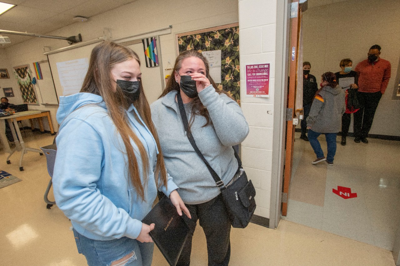 Jack Miner, Vice Provost for Enrollment Management surprised Brooke Bartholomew future UC Bearcats with Marian Spencer Scholarship award at Clark Montessori High School Tuesday February 1, 2022. Marian Spencer Scholarship award students with full tuition, room and board and an all-expenses-paid study abroad experience from the University of Cincinnati. Photos by Joseph Fuqua II