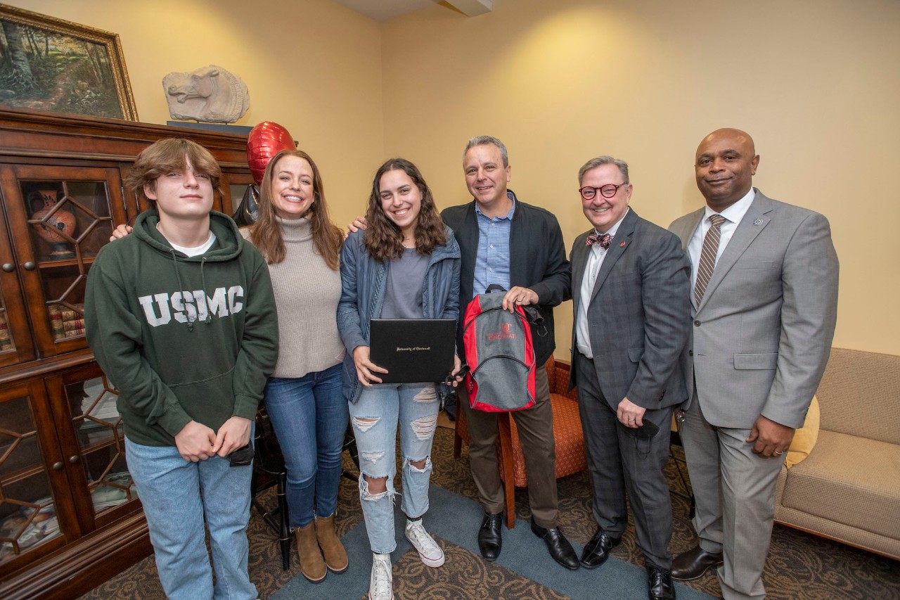 Jack Miner, Vice Provost for Enrollment Management surprised Julia Berman future UC Bearcats with Marian Spencer Scholarship award at Walnut Hills High School Tuesday February 1, 2022. Marian Spencer Scholarship a award students with full tuition, room and board and an all-expenses-paid study abroad experience from the University of Cincinnati. Photos by Joseph Fuqua II