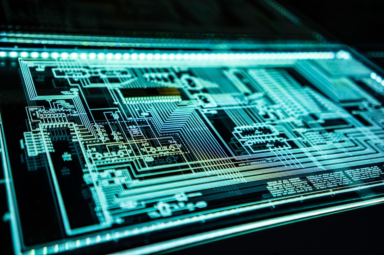 An illuminated schematic of a computer chip.