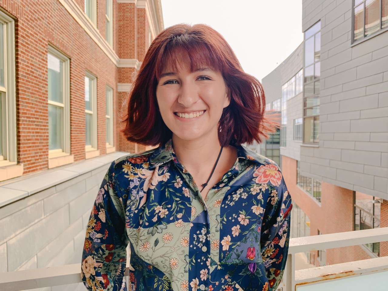 Kylie Boyer stands outside Swift Hall on UC's campus.