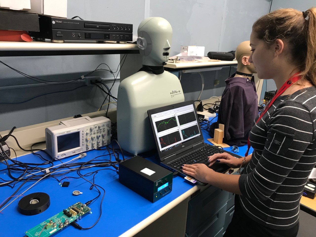 Anna Lanzillotta working on electrical sound equipment