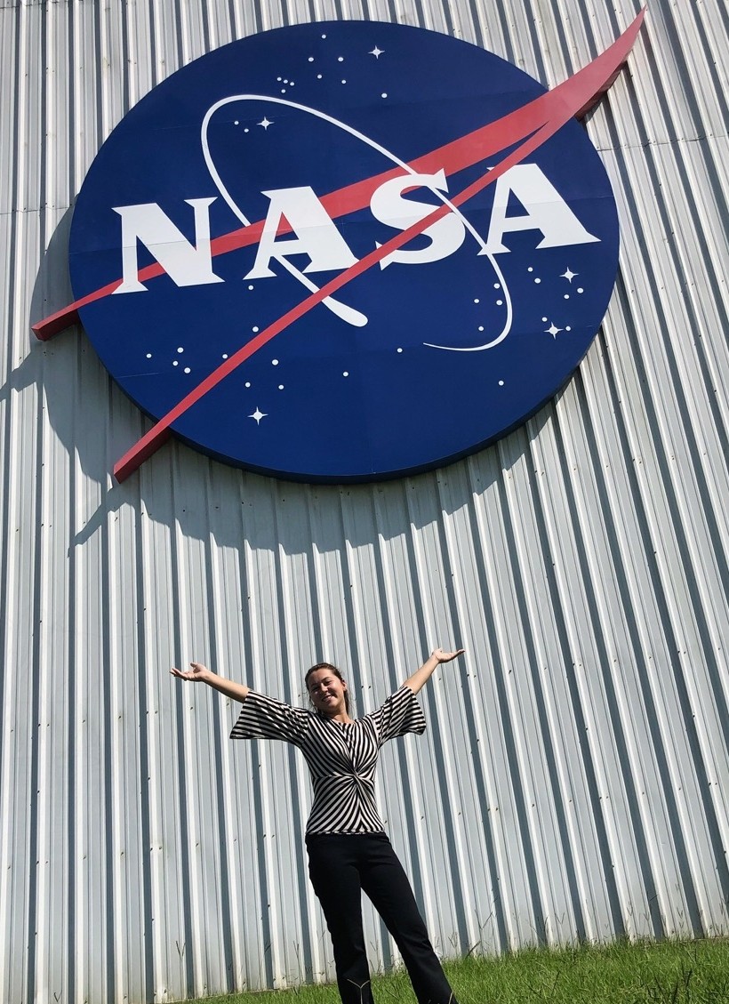Anna Lanzillotta stands by the NASA sign