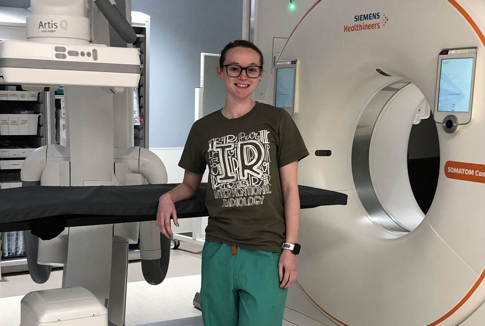 Shelby Schepis in front of CT scanner