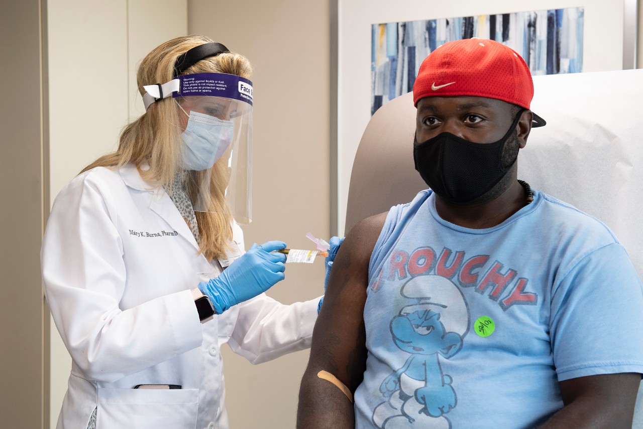 a patient receives a COVID-19 booster shot