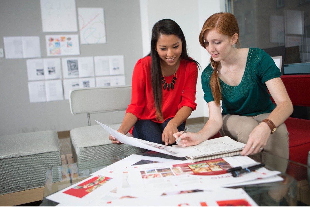 two women reviewing papers