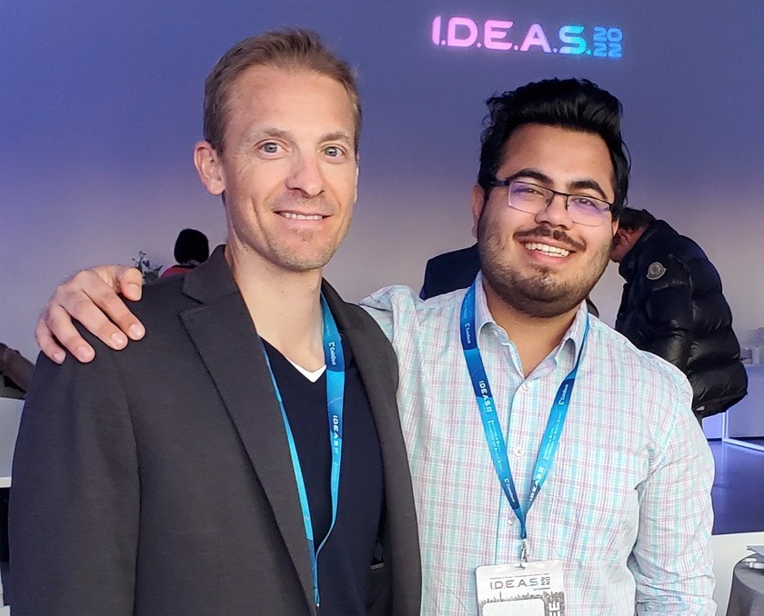 Kunal Kewalramani, right, poses for a photo with another winner at CoinDesk's I.D.E.A.S. Conference. 