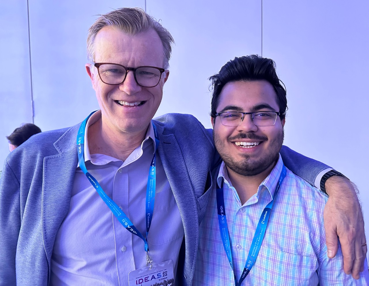 Michael Casey, left, the chief content officer of CoinDesk, and Kunal Kewalramani, a senior who is studying computer science in UC’s College of Engineering and Applied Science, pose for a photo at CoinDesk's I.D.E.A.S. Conference in New York.