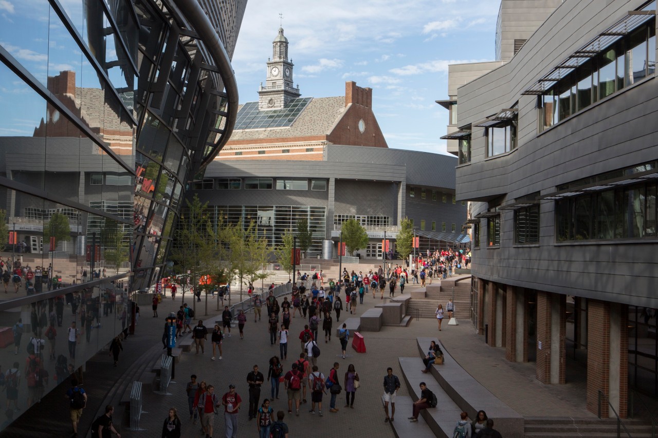 street view of UC campus Mainstreet with students walking around campus by the Tangeman University center and the UC Rec center