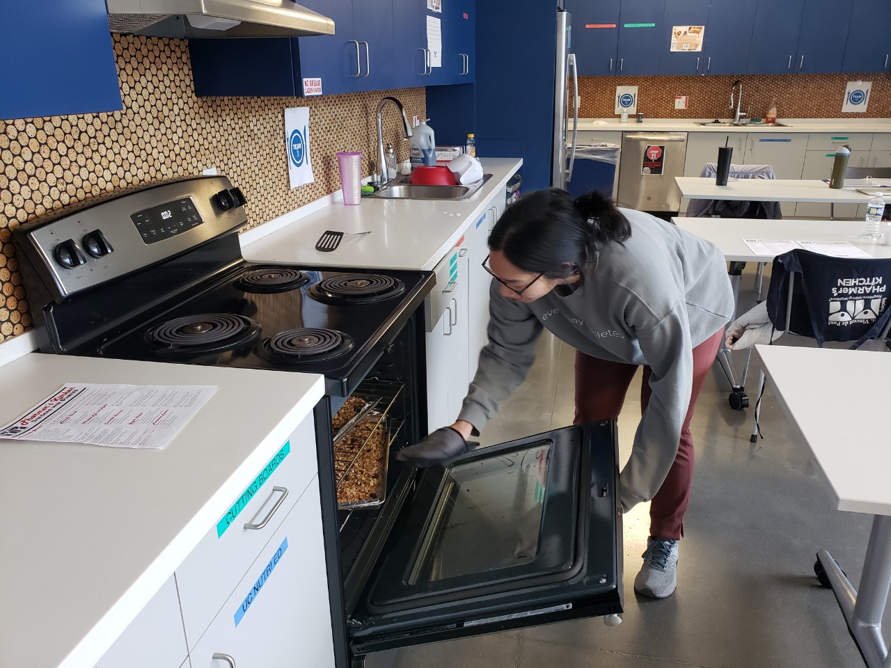 Monica Chen shown teaching a healthy cooking class at St. Vincent de Paul.
