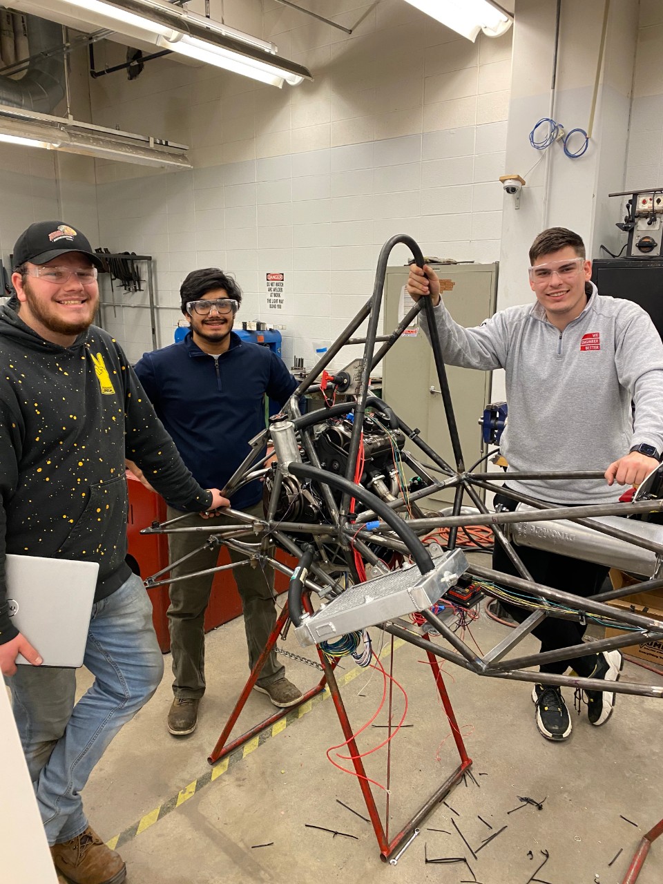 Miskovic working on wiring harness. 