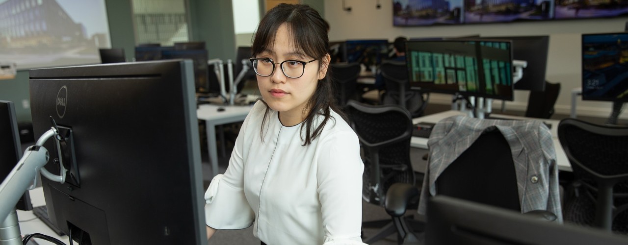 Woman at computer in UC's 1819 Innovation Hub.
