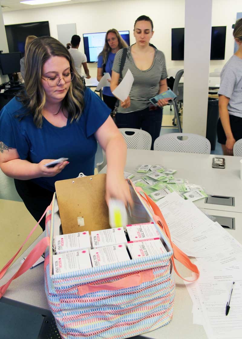 Hamilton County Public Health representative distributes Narcan to students