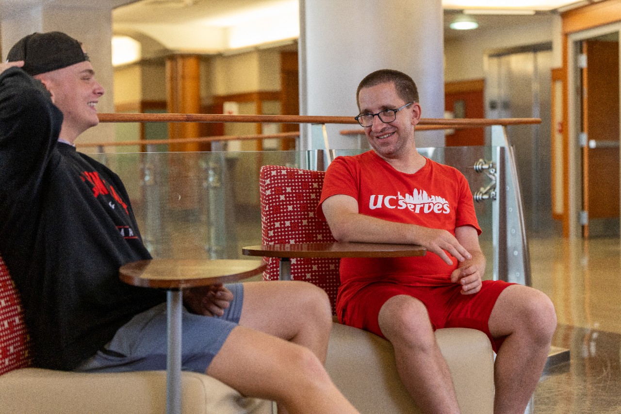 IMPACT Associate conversing with IDD Education Center student worker. Photo/ provided. 