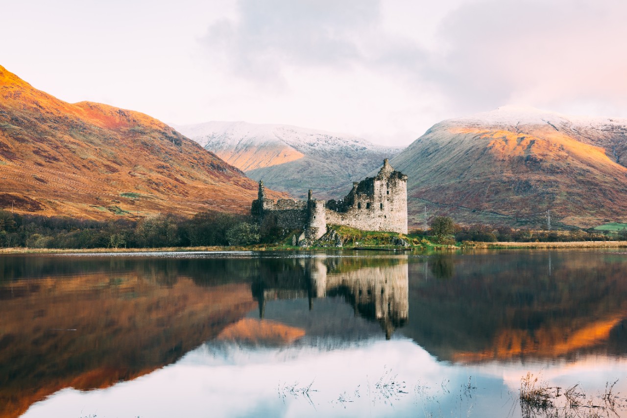 Kilchurn Castle in Scotland. Photo via Unsplash. Taken by Connor Mollison. 