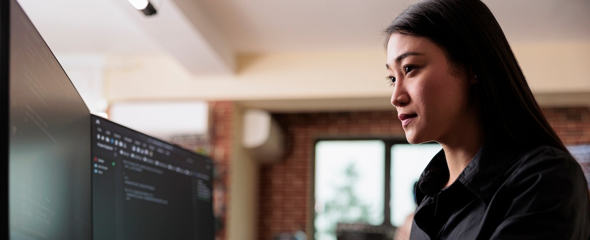 Cyber security company employee developing blockchain based database processing system. Cybernetic officer coding a machine learning software to protect mainframe encrypted files.