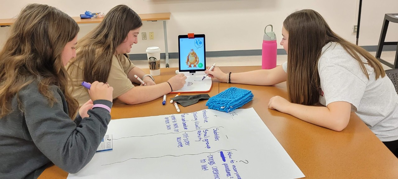 Elementary Education students work together on a lesson plan.