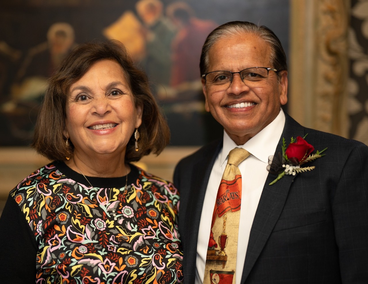 a man and woman pose 