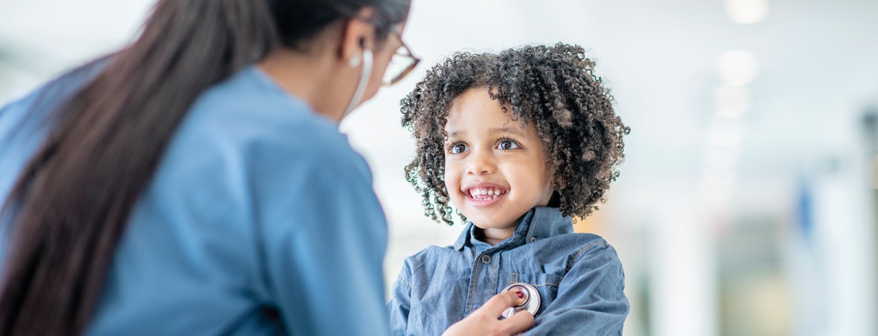 nurse examining child