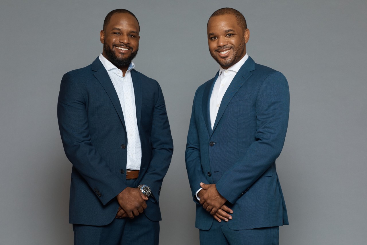 André Eanes (left) and Aaron Eanes (right) standing together as the figureheads of A&A Management.