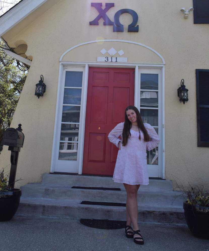 Julie Holkovic poses in front of her sorority house. 