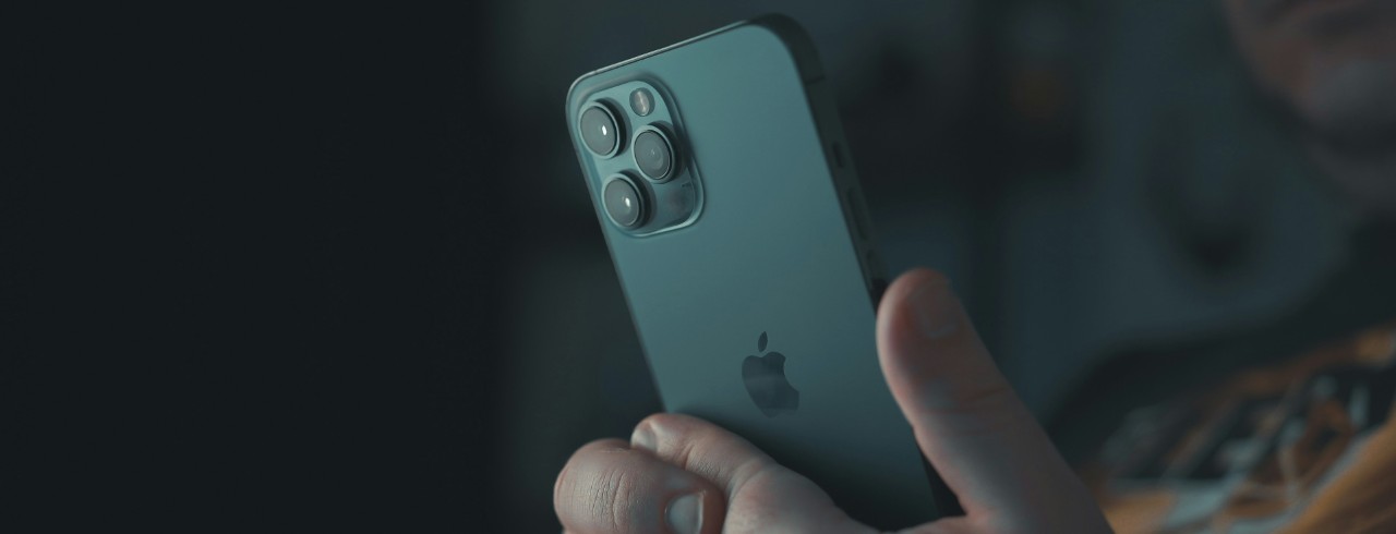 A closeup photo of a person using an iPhone.