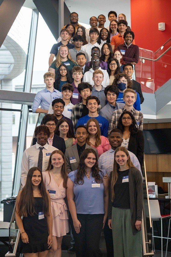 A group of about 40 high school students pose on a flight of stairs