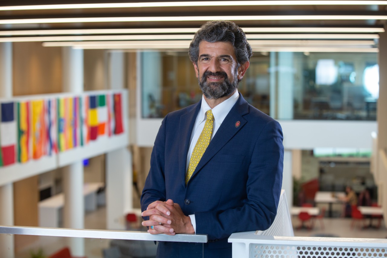Photo of Haider Ala Hamoudi, Dean of the College of Law, on the second floor of the law school