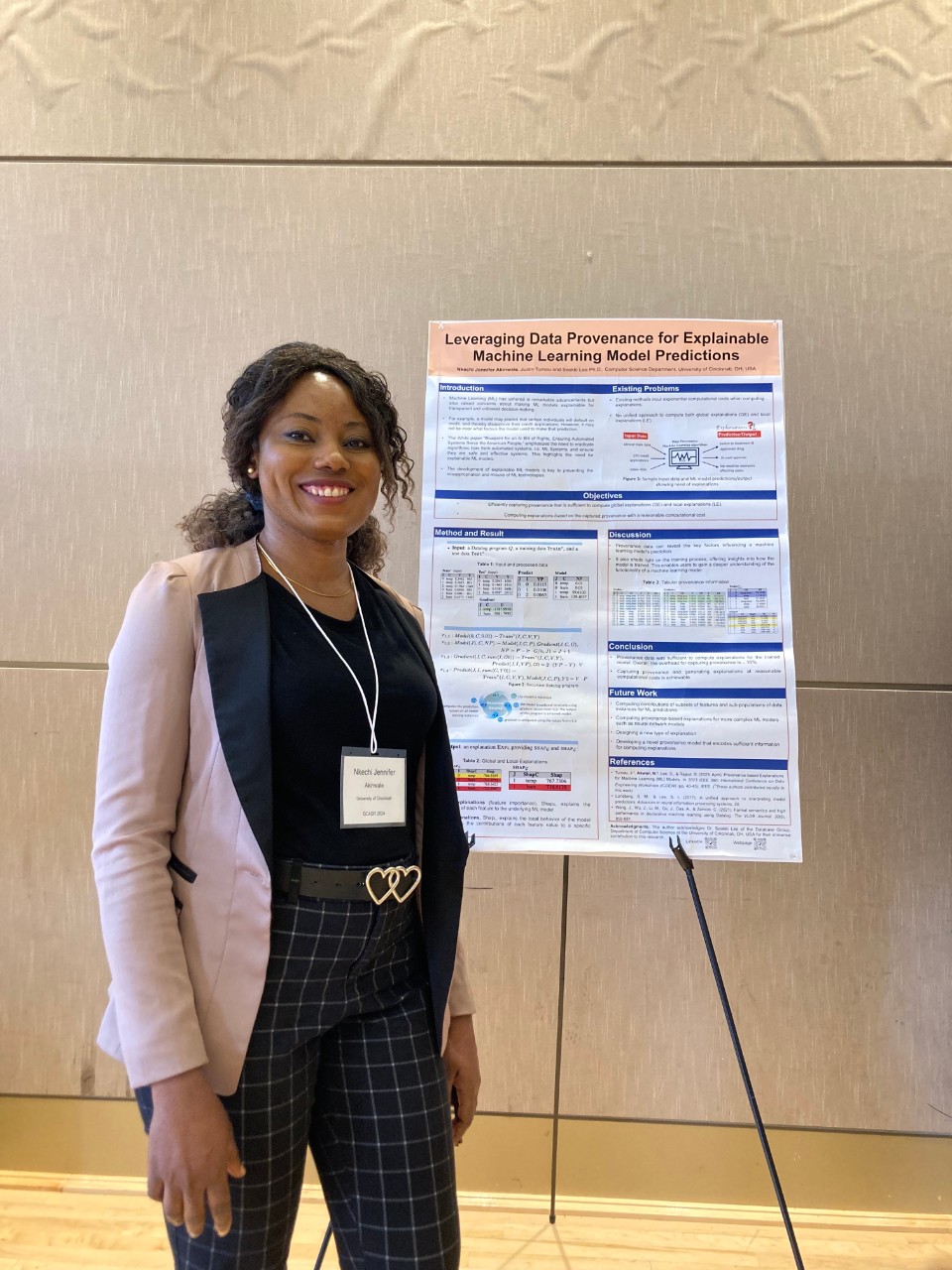 Nkechi Jennifer Akinwale poses with one of her research posters