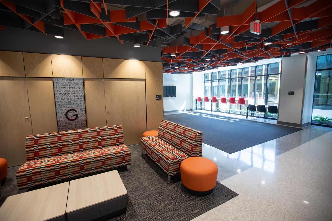 Siddall Hall lounge area shows chairs, couch, tables and lots of natural light
