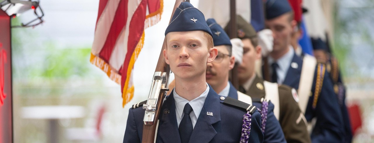 UC cadet carrying a flag in the 2023 Veterans Day opening ceremonies
