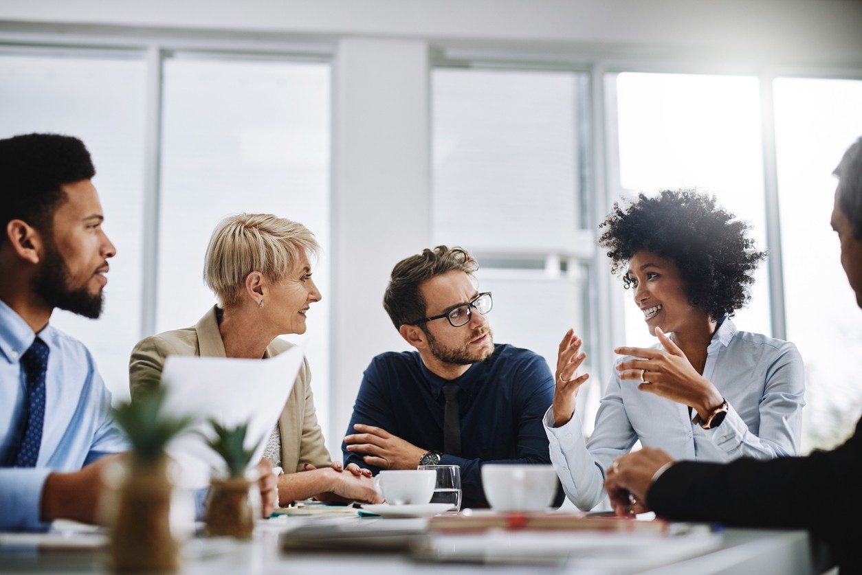 Professionals sitting at a table talking