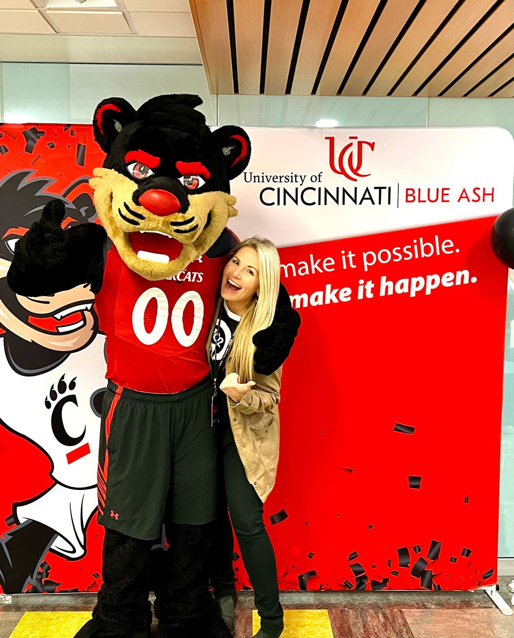 bearcat mascot with laughing woman