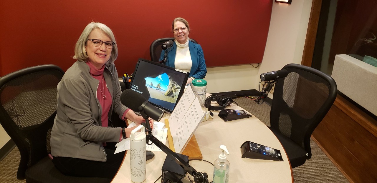 Two women, Lucy May and Anne Lofaso, seen sitting in the WVXU radio studio