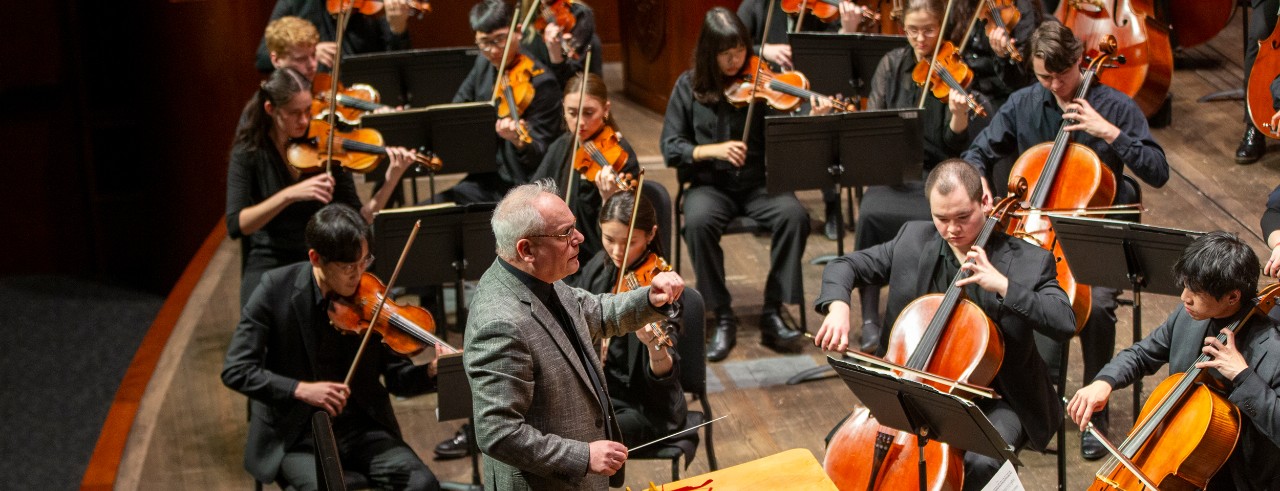 The CCM Philharmonia student orchestra performs on the stage of Corbett Auditorium during CCM's 2025 "Moveable Feast" gala fundraiser. CCM faculty member Mark Gibson conducts. Photo/UC Marketing + Brand