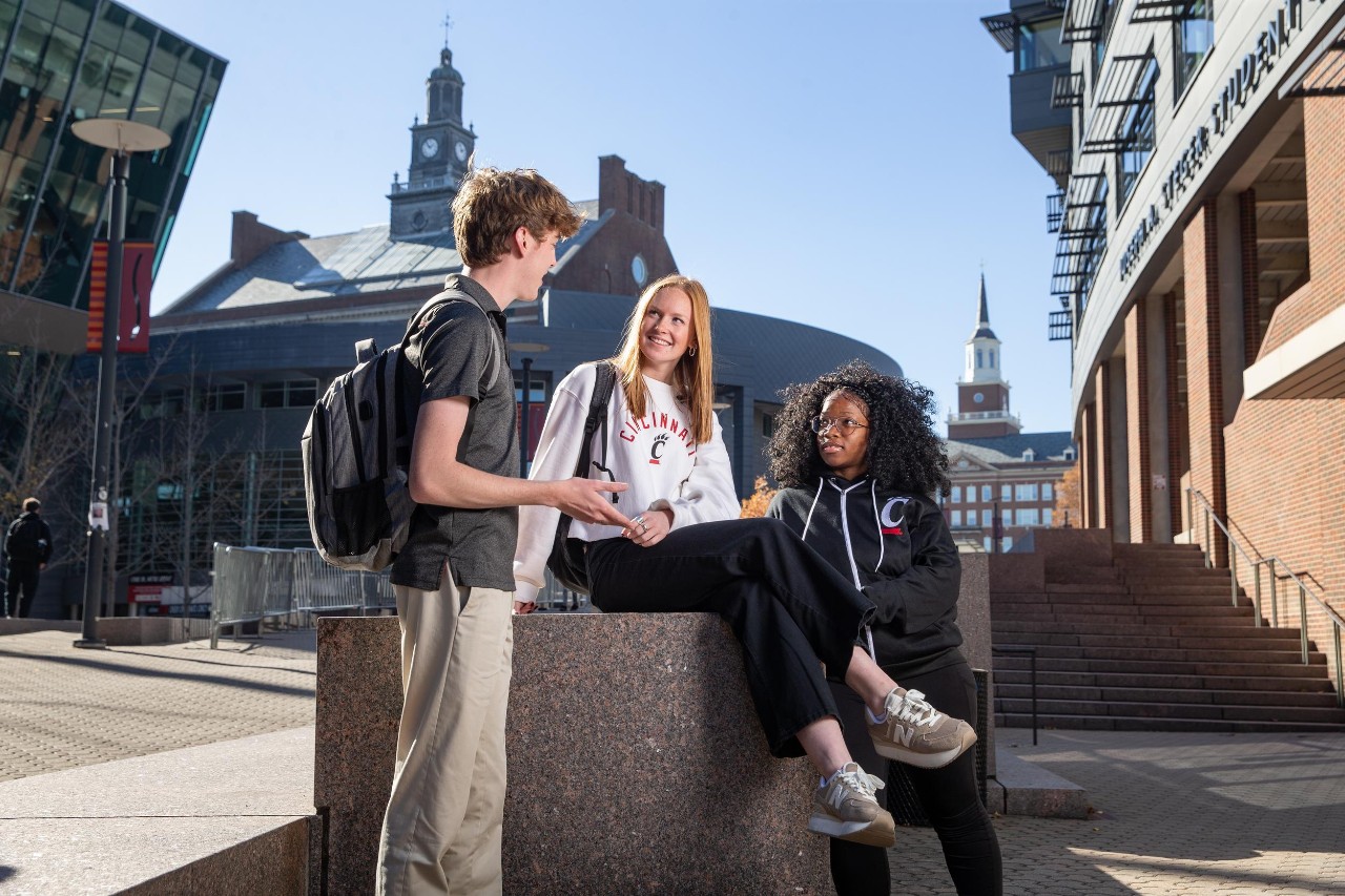 UC students talking on Mainstreet